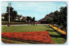 1954 The CPR Station and Beautiful Flower Gardens Kenora Canada Postcard picture