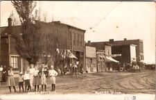 Antique RPPC Postcard Ashley MI Main St Kids in Street Harness Shop Horse Buggy picture