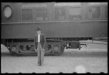 Man in railroad station,Manchester,Georgia,GA,Train Station,May 1938,Vachon picture