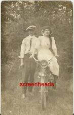 C1910 GIRL LONG HAIR ON BICYCLE OR MOTORCYCLE RPPC PHOTO picture