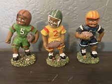 VINTAGE HAND MADE CERAMIC FOOTBALL PLAYER FIGURINES. APPROX. 4” HIGH. picture