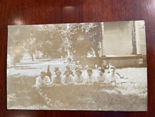 Antique RPPC Postcard - Seven Women Poising for Photo on Stomachs picture