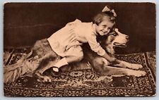 Animals~Smiling Girl Hugging Fluffy Dog~B&W Photo~Vintage Real Photo Postcard picture