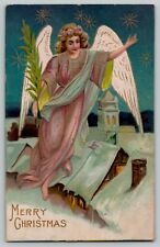 c 1909 Christmas Angel on above Snowy Rooftops Stars Embossed Vintage Postcard picture