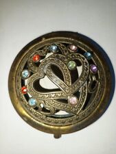 A very old antique brass hand mirror embroidered with natural stones picture