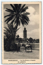 c1940's Buck Riding The Koutoubia Through Palm Trees Marrakesh Morocco Postcard picture