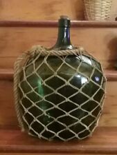 Vintage demijohn bottle 16 in high green with original knotted rope netting picture