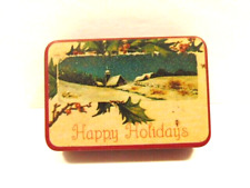 older pocket size tin: winter scene and captioned Happy Holidays picture