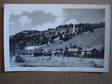 BASIN MONTANA RPPC POSTCARD IN 1940'S. BY JEAN C FISHER. OLD SMELTER TOWER REAR  picture