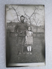 VINTAGE RPPC~REAL PHOTO POSTCARD~SOLDIER AND LITTLE GIRL picture