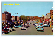 Postcard SD Pierre Busy Main Street View 1950's Cars Storefronts Signs Rexall picture
