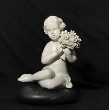 Girl W/ Flowers Sits on a Black Rock, Vintage White Matte Porcelain Figurine picture