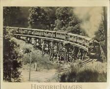 Press Photo Visitors ride Puffing Billy train near Melbourne, Australia picture