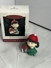VINTAGE PEANUTS HALLMARK CHRISTMAS ORNAMENT PEANUTS GANG LUCY WITH FOOTBALL 1994 picture