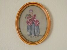 Vintage Needlework of a Woman in a Pink and Blue Dress with Flowers picture