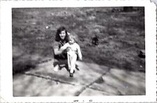 VINTAGE FOUND PHOTO - 1960S B&W - BLUR EXPOSURE PUPPY WATCHES WOMAN AND GIRL picture