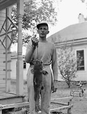 VINTAGE B/W PHOTO NEGATIVE - MAN HOLDING HIS VERY LARGE CATFISH picture