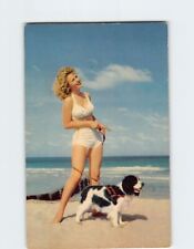 Postcard Woman & Dog Strolling on the Beach picture