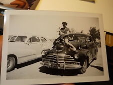 VINT SNAPSHOT PHOTO, WOMAN MOUNTS HOOD OF CALIFORNIA CAR PLAYING HORSEY picture