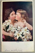 Postcard Two Young Girls Holding Lilies Flowers picture