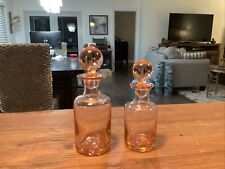 Two Art Deco pink glass perfume bottles picture