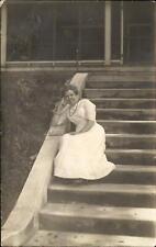 RPPC woman sitting on steps ~ fashionable little purse ~ real photo 1904-1918 picture