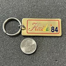 1984 Florida 84 Gold Tone Metal Souvenir Keychain Key Ring #42568 picture