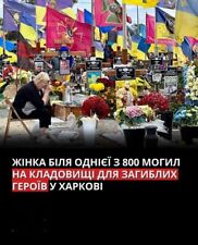 Postcard - War in Ukraine. Woman at the cemetery of fallen heroes in Kharkiv picture