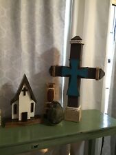 wooden cross with colored cross in center picture