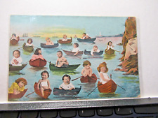 UNUSUAL HUMOROUS POSTCARD SHOWING MANY CHILDREN ROWING BOATS picture