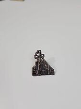 PLASTIC Butte Montana Travel Souvenir Pin Black & Copper Colors picture