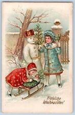 1910's FROHLICHE WEIHNACHTEN MERRY CHRISTMAS SNOWMAN KIDS SLED EMBOSSED POSTCARD picture