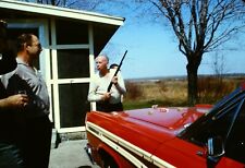 VTG 1960s 35MM SLIDE GUY WITH RIFLE AND SHELLS RED FORD THUNDERBIRD #30-2U picture