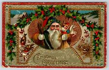 Postcard Embossed Brown Robe Santa Christmas Holding Toys Holly Birds picture