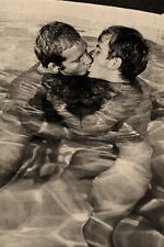 Nude men kiss in swimming pool   - reprint picture