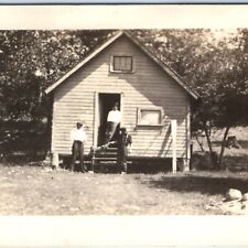 c1920s Handsome Young Men w/ Fishing Catch RPPC Cabin Shack Camp Real Photo A134 picture