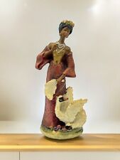 Figurine Of An Elegant Black Woman In A Pink Gown, with A White Swan. picture