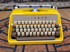 vintage mustard yellow Triumph portable typewriter working with case picture