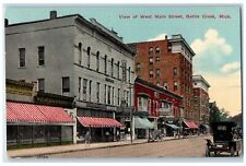 1913 View of West Main Street Dirt Road Establishments Battle Creek MI Postcard picture