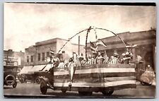 Postcard American Parade Antique Truck Wooden Chairs Street Kodak Sign RPPC T111 picture