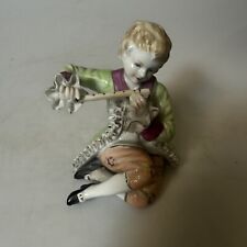 German Porcelain Boy Playing a Flute. Crossed Swords picture