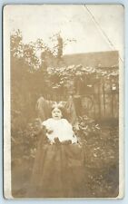 Postcard Small Child sitting for Photo on Chair outside Home RPPC B197 picture