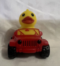Yellow Rubber Duck in a Red Squeaking Jeep Ducking Dashboard Ornament picture