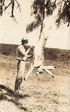 RPPC Man Cleaning Large Jack Rabbit Postcard picture