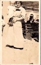 Real Photo Postcard Mother Holding Baby in the Sand in Long Beach, California picture