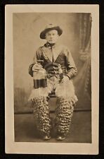 Incredible RPPC of Cowboy with Bottle of Whiskey Wearing Wooly Chaps. C 1920's  picture