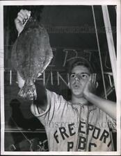 1950 Press Photo Phillip Roberts, 15, look at his prize 4 lb fluke fish picture