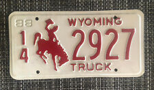 Vintage 1988 Wyoming Truck Metal License Plate ~ Red & White Bronco~Cowboy picture