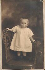 RPPC Postcard Toddler Standing in Fancy Wicker Chair Cute Smile Pendent Necklace picture