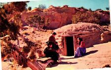 Navajo Family At The Entrance To Their Hogan Postcard picture